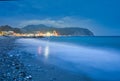 Sea shore and large metal cranes in Riva Trigoso Shipyard during summer night