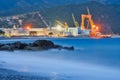 Large metal cranes in Riva Trigoso Shipyard during summer night