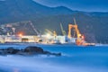 Large metal cranes in Riva Trigoso Shipyard during summer night