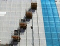 Cantilever scaffolds on a residential building under renovation. Royalty Free Stock Photo