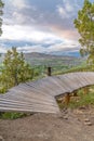 Cantilevered curving old wooden boardwalk for biking