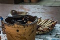 Canting and hot wax on top of wood table for Batik processing photo taken in Pekalongan Indonesia Royalty Free Stock Photo