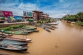 Inle Boat Station in Inle Nyaung Shwe Canal. A series of fishing boats along the river generated by Inle Lake. Homes in the backgr Royalty Free Stock Photo