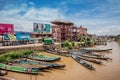 Inle Boat Station in Inle Nyaung Shwe Canal. A series of fishing boats along the river generated by Inle Lake. Homes in the backgr Royalty Free Stock Photo