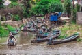 Inle Boat Station in Inle Nyaung Shwe Canal in Burma. A series of wooden fishing boats along the river generated by Inle Lake