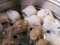 Cantonese starters har kau dumplings in steamer cooking