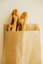 Cantucci cookies with candied fruits and nuts in a paper bag. White background Royalty Free Stock Photo