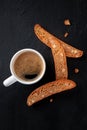 Cantucci. Italian almond cookies with a cup of coffee, shot from the top Royalty Free Stock Photo