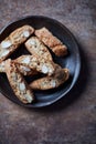 Cantuccini Italian biscuits on rustic stone background. Top view.