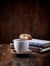 Cantuccini (Italian cookie) and a Cup of coffee on rustic wooden background.