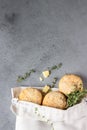 Canvas bag with homemade scone with cheese, thyme and pieces of cheese. Freshly baked delicious English scones.