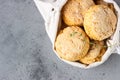 Canvas bag with homemade scone with cheese, thyme and pieces of cheese. Freshly baked delicious English scones.