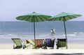 canvas bed and umbrellas on the beach Background Blurry Tourism and sea