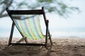 A canvas bed on white sand and sea sky background. On vacation relax travel sitting canvas chair sand beach Royalty Free Stock Photo