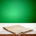 Canvas napkin with lace, tablecloth on wooden table and green background. Can used for display or montage your products Royalty Free Stock Photo