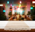 Canvas napkin with lace, tablecloth on wooden table and pizzeria interior. Can used for display or montage your products Royalty Free Stock Photo