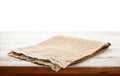 Canvas napkin with lace, tablecloth on wooden table on white background. Can used for display or montage your products Royalty Free Stock Photo