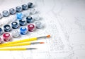 Canvas and paints of different colors, brushes. Painting by numbers. Creative hobby. Selective focus. Close-up Royalty Free Stock Photo