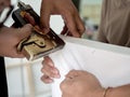 Hands using staple gun on wooden stretcher bar to make artist canvas Royalty Free Stock Photo