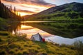 canvas tent on the shore of a quiet mountain lake at sunrise