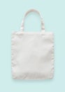 Canvas tote bag mockup blank white eco shopping sack template made of fabric cloth isolated on pastel blue background Royalty Free Stock Photo