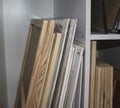 Canvases and Picture Frames Arranged by Size in Cells on the Shelf of the Stationery Store. Variety of Professional Blanks for Royalty Free Stock Photo