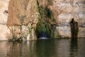 The canyon Ein Avdat is formed by the Qing River. Israel. Picturesque waterfall in the middle of the Negev desert