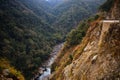 Canyon of mountain river on steep slopes, misty canyon, flashy river. Foothills Of Himalayas. Bhutan Royalty Free Stock Photo