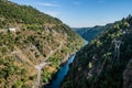 Canyon with rocks and vegetation and river ZÃÂªzere, aerial view on Cabril dam with bridge, PedrogÃÂ£o Grande PORTUGAL