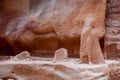 Canyon Siq or El Siq in Petra Jordan. Only road to rock city of Nabatean kingdom, to ancient city of Petra. Huge rocks hang Royalty Free Stock Photo