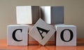 CAO - acronym on large wooden cubes on light brown background Royalty Free Stock Photo