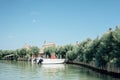 Caorle, Venice lagoon Italy. Boats moored in front of the characteristic 