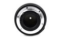 Cap of a black colored digital camera isolated on a white paper background Royalty Free Stock Photo