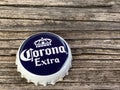 Rockford,WI/USA.- Feb 12, 2019: Cap of Corona Extra beer close up on wooden table. Corona is the most popular imported beer in the