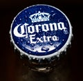 Cap of Extra Corona beer. Water drops.