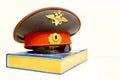The cap of a Russian police officer is on the code of laws. Royalty Free Stock Photo