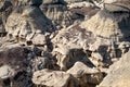 Cap stones create shelves for hikers to traverse in the Bisti Badlands Royalty Free Stock Photo