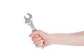 A cap wrench, a split wrench in the hand of a worker, a builder, isolated on a white Royalty Free Stock Photo