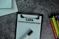 CAPA - Corrective and Preventive Action write on a paperwork on the table