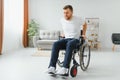 Capable disabled trying to get up from the wheelchair Royalty Free Stock Photo