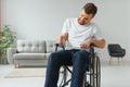 Capable disabled trying to get up from the wheelchair. Royalty Free Stock Photo