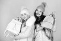 Capacious bag. girls in beanie with leather bag. women in padded warm coat. christmas. winter clothing fashion. down