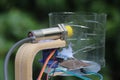 Capacitive proximity sensor with micro servo and rain sensing module working combined in detection of wet dry and metal objects