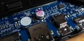 Capacitor and other surface mount components on the motherboard of a laptop computer. Royalty Free Stock Photo