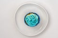 Capcake with blue cream on a white background. Isolate Royalty Free Stock Photo