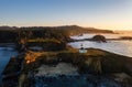 Cape Arago Lighthouse at the Oregon Coast at sunset. Also seen are Shore Acres and Sunset Bay State Park. Royalty Free Stock Photo