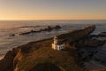 Cape Arago Lighthouse at the Oregon Coast at sunset. Royalty Free Stock Photo