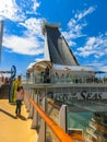 Cape Canaveral, USA - April 29, 2018: The passenger flying at zip line at cruise liner or ship Oasis of the Seas by Royalty Free Stock Photo