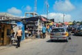 Cityscape of Local African Cape Coast town with Ghana People and Cars on the street