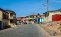 Cityscape of Local African Cape Coast town with Ghana People and Cars on the street